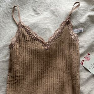 Light brown bodysuit with lacing detail from Altar’d State.